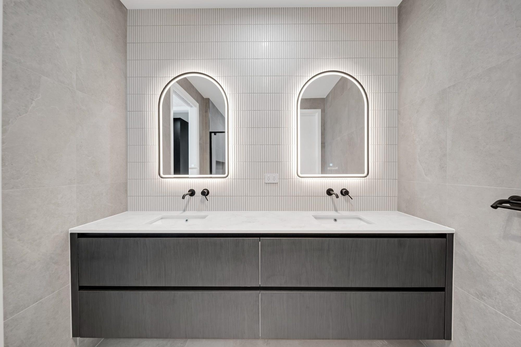 Twin mirrors and floating vanity